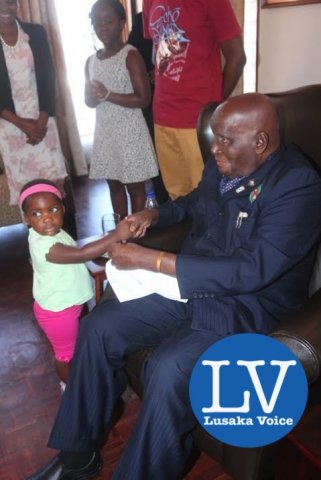 KK with one of his great grand daughters Milika Nyilenda. - Photo Credit Jean Mandela - Lusakavoice.com