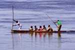 Local paddlemen provide a valuable service for goods and for people alike.  Moving swiftly with the current and slowly against it, transportees sometimes make multi-day trips in this manner.