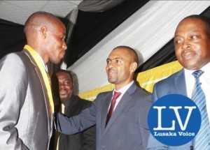 Minister Vincent Mwale congratulating ZESCO United Captain Jacob while looking on are  Acting MTN CEO Clement Asante and  FAZ President Kalusha  Bwalya!  - Photo Credit Jean Mandela - Lusakavoice.com