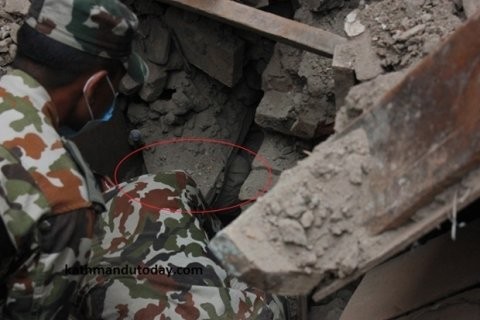 One picture appeared to show the boy, named locally Sonit Awal, four months old, buried deep under rubble and bricks.