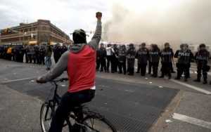 Police Watch as Baltimore Burns