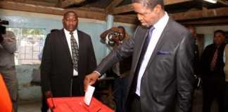 President Edgar Chagwa Lungu casts his vote at Andrew Mwenya Polling Station in Lusaka's John Howard Township on April 14,2015.