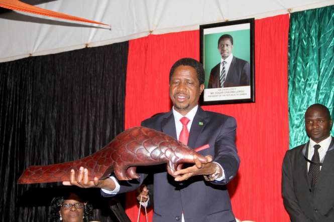 President Edgar Chagwa Lungu displays a gift given to him by Zambian's living in Zimbabwe at Zambia's Ambassador to Zimbabwe's residence in Harare where he addressed them on April 29,2015 -Picture by THOMAS NSAMA