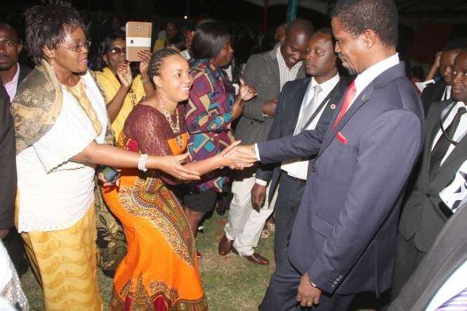 President Edgar Chagwa Lungu greets Zambians at Zambia's Ambassador to Zimbabwe's residence in Harare where he addressed them on April 29,2015 -Picture by THOMAS NSAMA