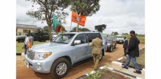President Edgar Chagwa Lungu walks to his Presidential vehicle before going to Senga Hill Constituency to drum up support for the Patriotic Front (PF) Candidate Kapembwa Simbao on Friday, April 10, 2015.