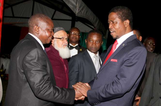 President Edgar Chagwa Lungu with Former Bank of Zambia Governor Caleb Fundanga at Zambia's Ambassador to Zimbabwe's residence in Harare where he addressed Zambia's living in Zimbabwe on April 29,2015 -Picture by THOMAS NSAMA