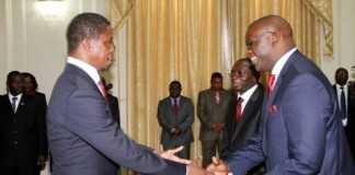President Edgar Lungu congratulates newly appointed Attorney General Likando Kalaluka as Newly appointed Foreign Affairs Permanent Secretary Chalwe Lombe looks on during the Swearing in Ceremony at State House on April 8,2015