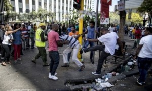 South Africa police fire rubber bullets and teargas on anti-immigrant protest
