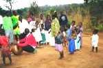 There are times the baby sibling may look bigger that the young girl. This was in a village at Muganda dance in Lundazi in Eastern Zambia in 2002.