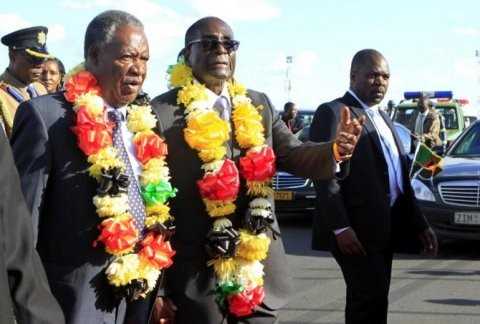 zimbabwe international trade fair-zimbabwe-president robert mugabe walks with zambian president sata - Credit ibtimes.jpg