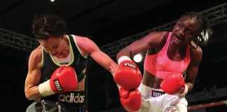 IRISH Christina McMahon in punch for punch with Zambian Catherine Phiri during the Female WBC Gold bout at Mulungushi International Conference Centre in Lusaka on Saturday. PICTURE- CHANDA MWENYA