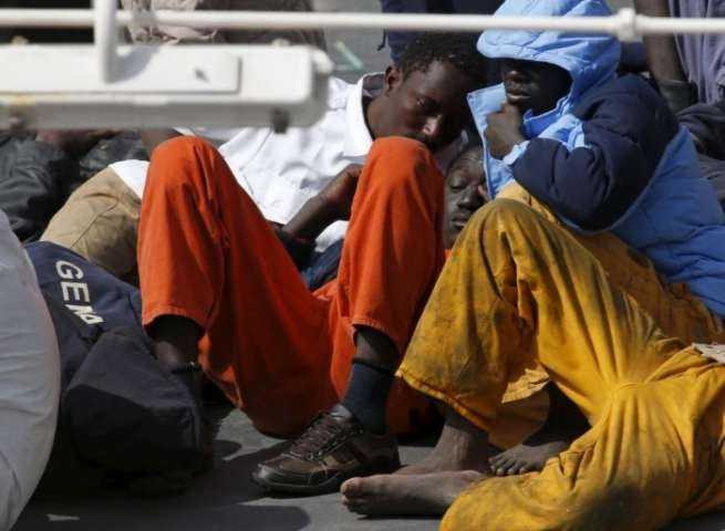 Migrants lie on the deck of the Italian coastguard ship Bruno Gregoretti in Senglea, Malta. Photograph- Darrin Zammit Lupi:Reuters