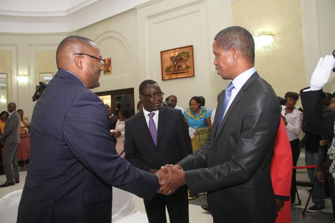 President Edgar Lungu congratulates Zambia's High Commissioner to South Africa Emmanuel Mwamba (r) during the swearing -In-Ceremony at State House on May 4,2015 -Picture by THOMAS NSAMA