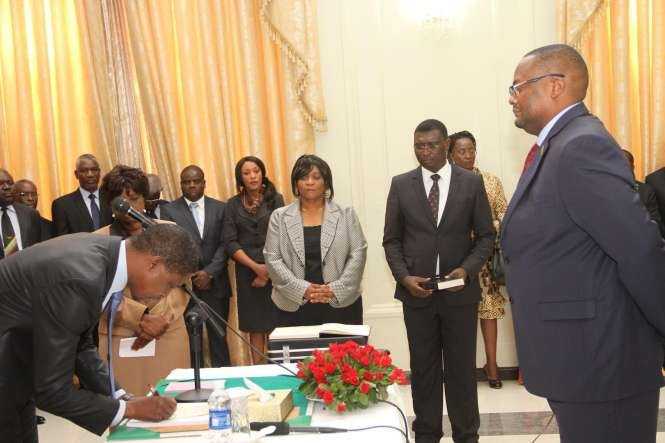 President Edgar Lungu signs on the affidavit of Oath document for Zambia's High Commissioner to South Africa Emmanuel Mwamba during the swearing -In-Ceremony at State House on May 4,2015 -Picture by THOMAS NSAMA:STATE HOUSE