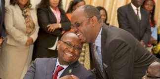 Zambia's High Commissioner to South Africa Emmanuel Mwamba being congratulated by PF deputy Chairman for Media Committee Sunday Chanda during the swearing -In-Ceremony at State House on May 4,2015 -Picture by THOMAS NSAMA