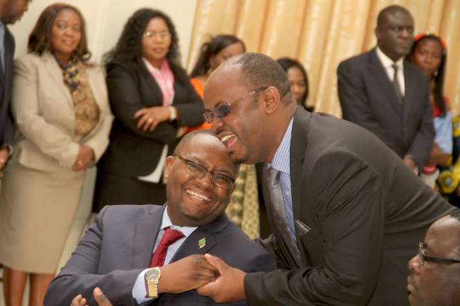 Zambia's High Commissioner to South Africa Emmanuel Mwamba being congratulated by PF deputy Chairman for Media Committee Sunday Chanda during the swearing -In-Ceremony at State House on May 4,2015 -Picture by THOMAS NSAMA