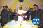 Lusaka Archdiocese Archbishop Telesphore George Mpundu joins newly ordained priests with Gender Minister Prof Luo Nkandu and Chiefs and Traditional Affairs Minister Joseph Katema  Jun 1, 2015