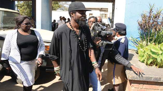 MUSICIAN Chama Fumba, alias Pilato, arriving at Lusaka Central Police yesterday. Picture by CLEVER ZULU