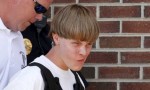 Police lead suspected shooter Dylann Roof, 21, into the courthouse in Shelby, North Carolina. Photograph- Jason Miczek:Reuters