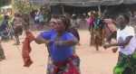 Shikaumpa Traditional Ceremony – Warriors carry out mimic fights, encouraged by the women