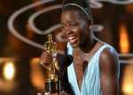 Lupita Nyong’o accepts the award for best actress in a supporting role for ’12 Years a Slave.’ Photo- AP