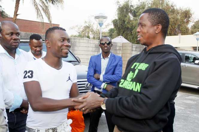 President Edgar Chagwa Lungu (right) shakes hands with Dandy Krazy during a meeting with Musicians at State House on Sunday, August 23,2015. PICTURE BY SALIM HENRY:STATE HOUSE ©2015 Dandy Krazy