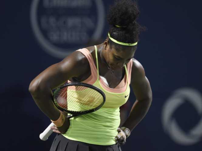 Serena Williams reacts in the third set against Belinda Bencic during the Rogers Cup semifinal tennis tournament, Saturday, Aug. 15, 2015 in Toronto. (Frank Gunn:The Canadian Press via AP) MANDATORY CREDIT Serena Williams