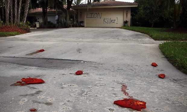 Walter Palmer’s vacation home was defaced with pigs feet drenched in hot sauce littering the driveway. Photograph- Corey Perrine:AP Walter Palmer