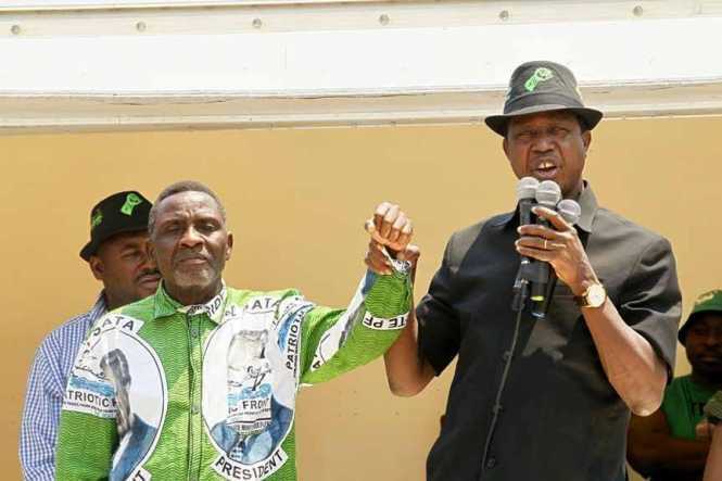 President Edgar Chagwa Lungu (right) introduces George Mwamba, the Patriotic Front(PF) Candidate for Lubansenshi Constituency 