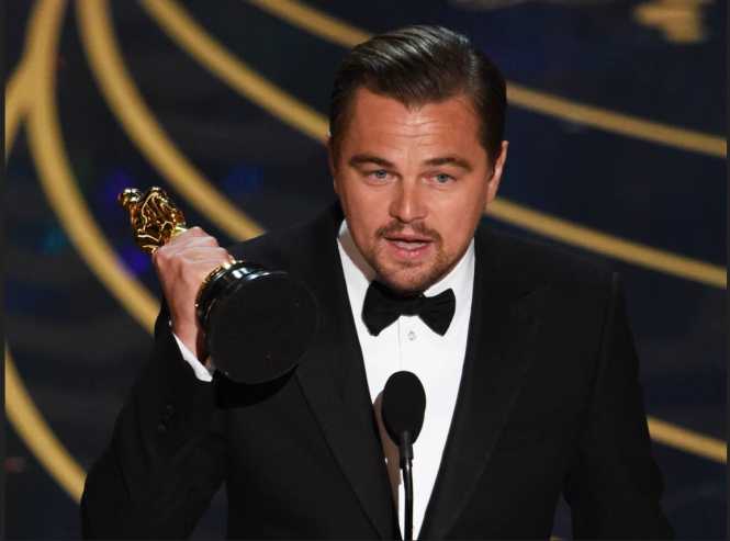 Leonardo DiCaprio accepts the award for best actor in The Revenant
