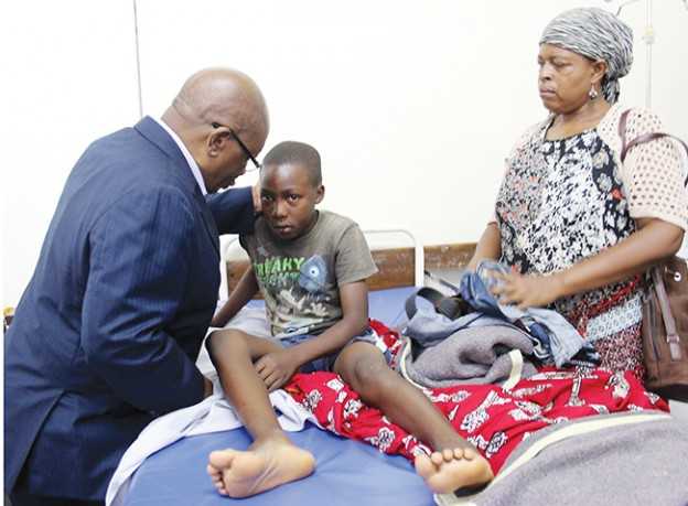 Minister John Phiri with Katuba accident survivor Mwanga Lyombe of Moomba Secondary - Photo Credit Daily Mail