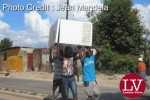 Some guys spotted along Matero- Lilanda carrying a fridge believed to have been looted.   – Lusakavoice.com