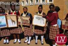 Kabulonga Girls pupils showing off their art work; the pupils were spotted at the school premises .