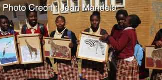 Kabulonga Girls pupils showing off their art work; the pupils were spotted at the school premises .