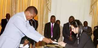 President Lungu receives an affidavit of Oath from newly appointed State Counsel Abha Nayar Patel during the Swearing-In-Ceremony at State House on Tuesday, June 14,2016