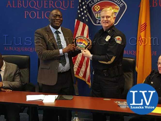Zambia police Inspector General Kakoma Kangaja with the chief of police of the city of Albuquerque Gorden England. Eden JR