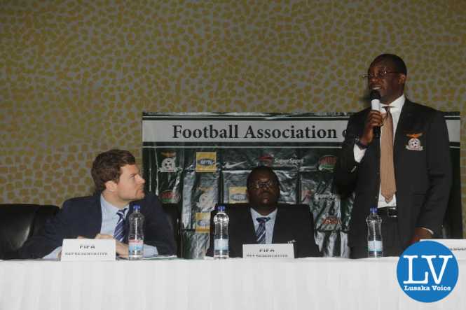 FAZ President Andrew Kamanga addressing the delegates while listening are FIFA Member Associations Manager Luca Nicola and FIFA Development Programmes Africa Manager Solaman Mudege