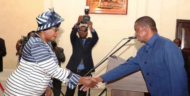 President Edgar Chagwa Lungu congratulates Dr Christine Kaseba -Sata after being sworn in as Zambia’s Ambassador to France during the Swearing-In-Ceremony at State House in Lusaka on Monday, April 16,2018-Pictures by THOMAS NSAMA