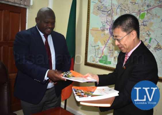 Minister of National Development Planning Hon. Alexander Chiteme presenting the 7th National Development Plan and Implementation Plan to China’s new Ambassador to Zambia Li Jie during the latter’s courtesy call on Thursday 5 June 2018. PHOTO | CHIBAULA D. SILWAMBA | MNDP