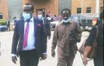 Mr Chinjenge (in suit) leaving the Lusaka Magistrate's Court this morning after the case was adjourned to December 8 this year for ruling on whether the case should be withdraw